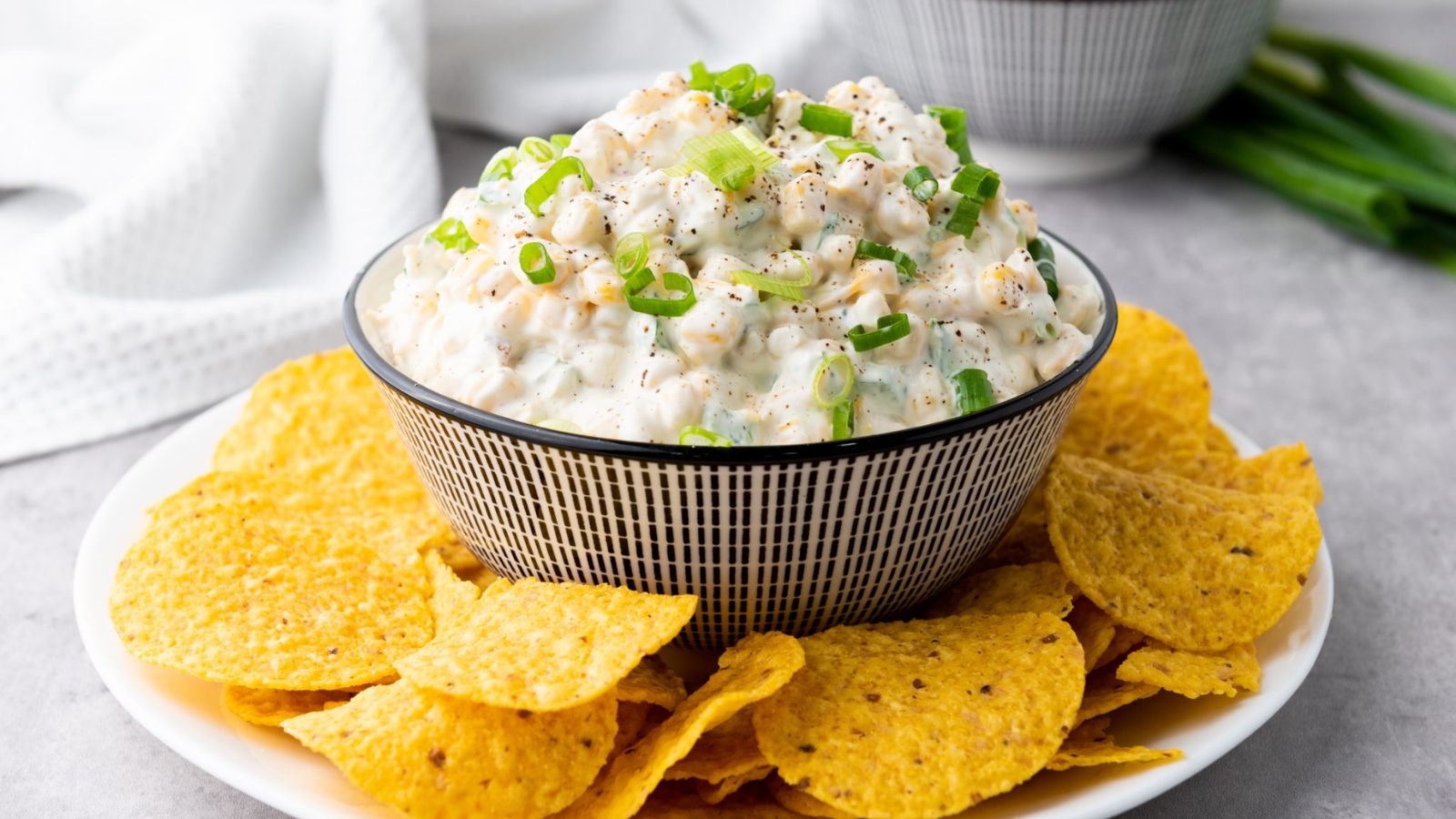 Corn dip with chips on the side.