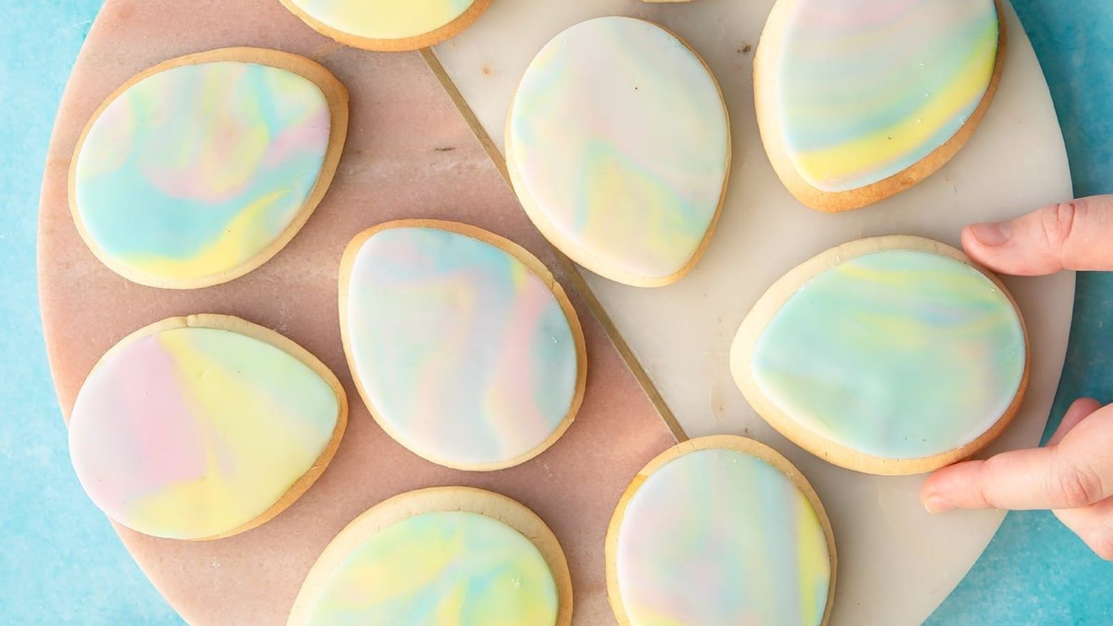 Easter egg cookies on a wooden board.