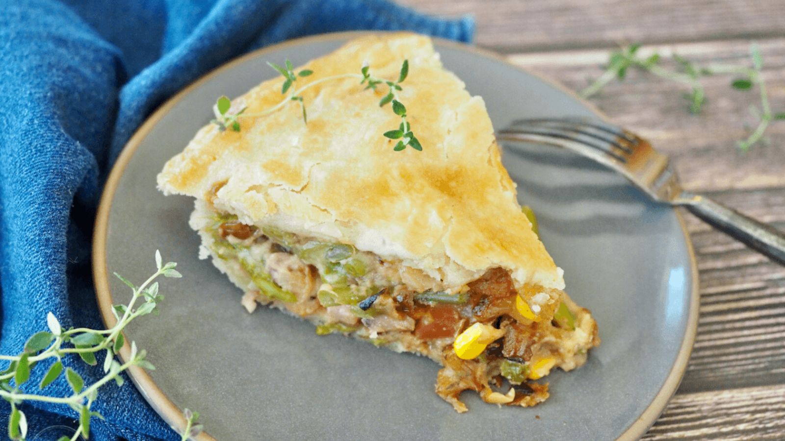 A slice of ham pot pie on a plate.