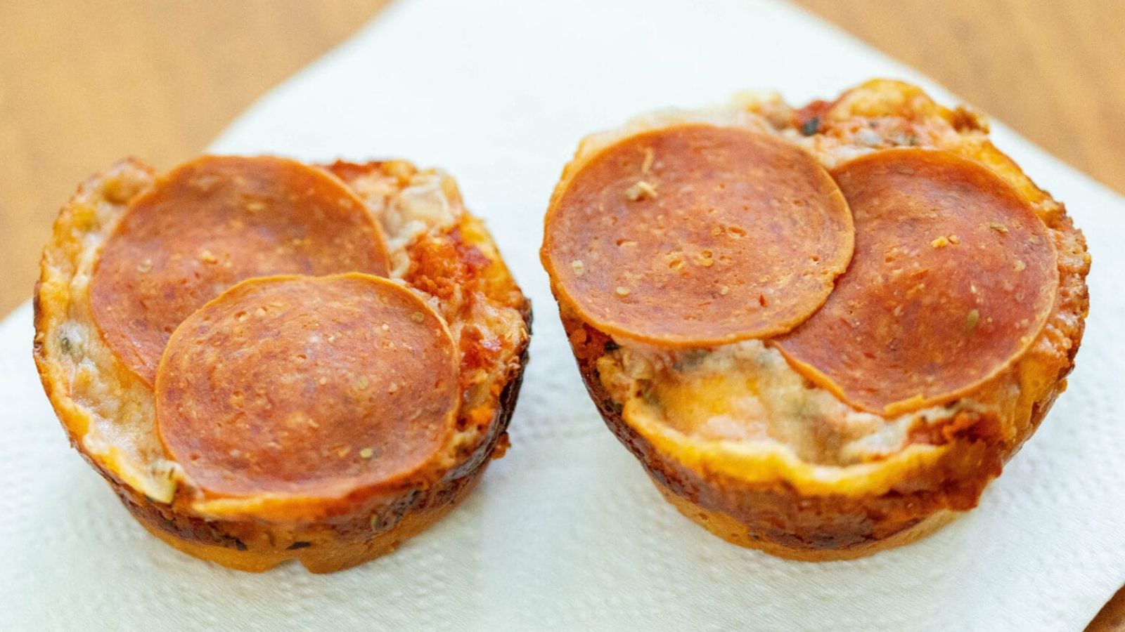 Pepperoni pizza muffins on a plate.