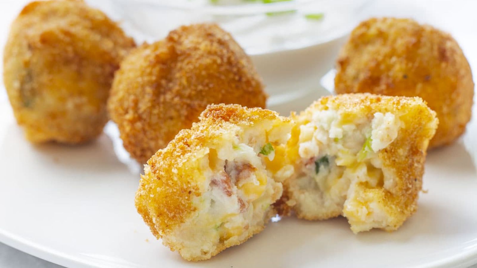 Mashed potato balls on a plate.