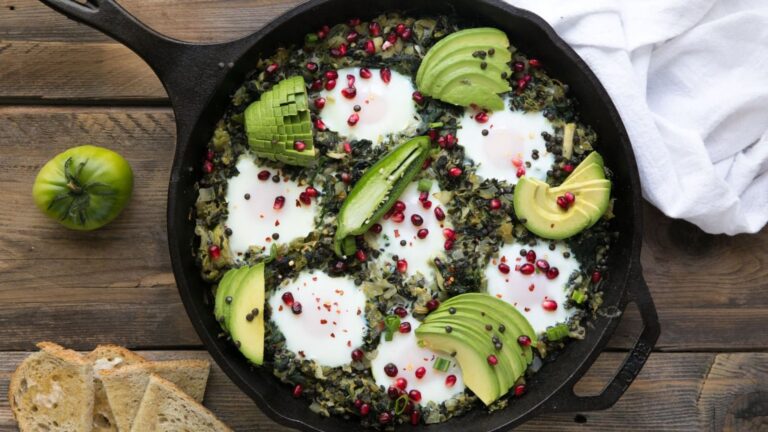 Green shakshuka in a pan.