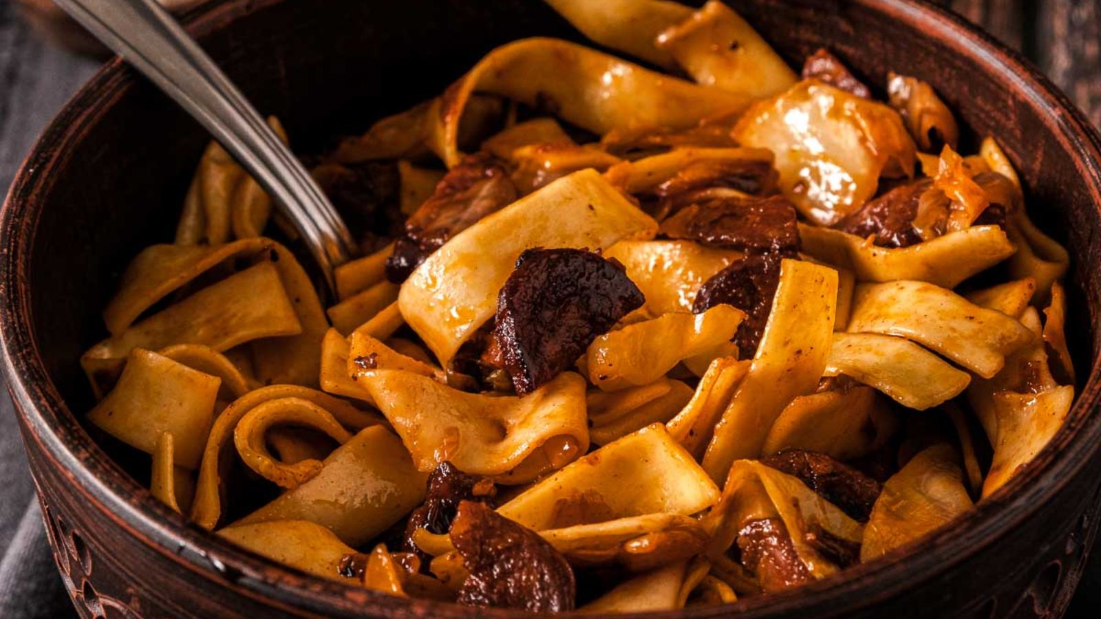 Egg noodles with onions and bacon.