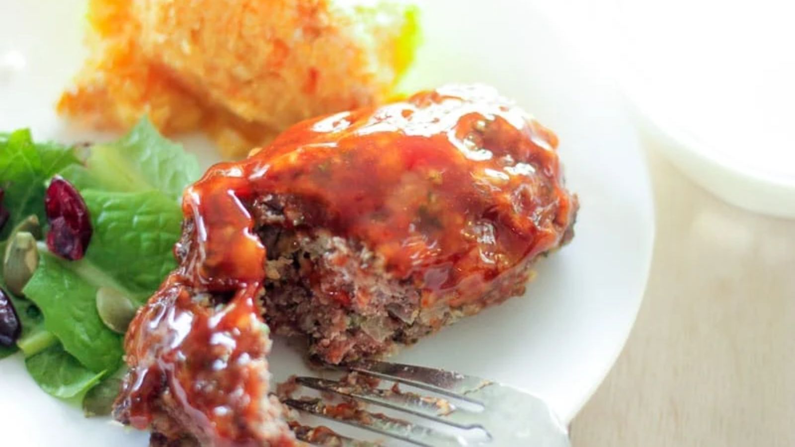 Mini meatloaf with sauce.