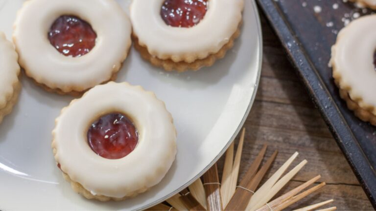 Jam filled cookies with white glaze.
