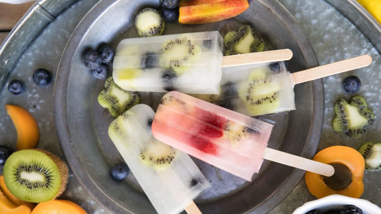 Fruit popsicles on a plate.