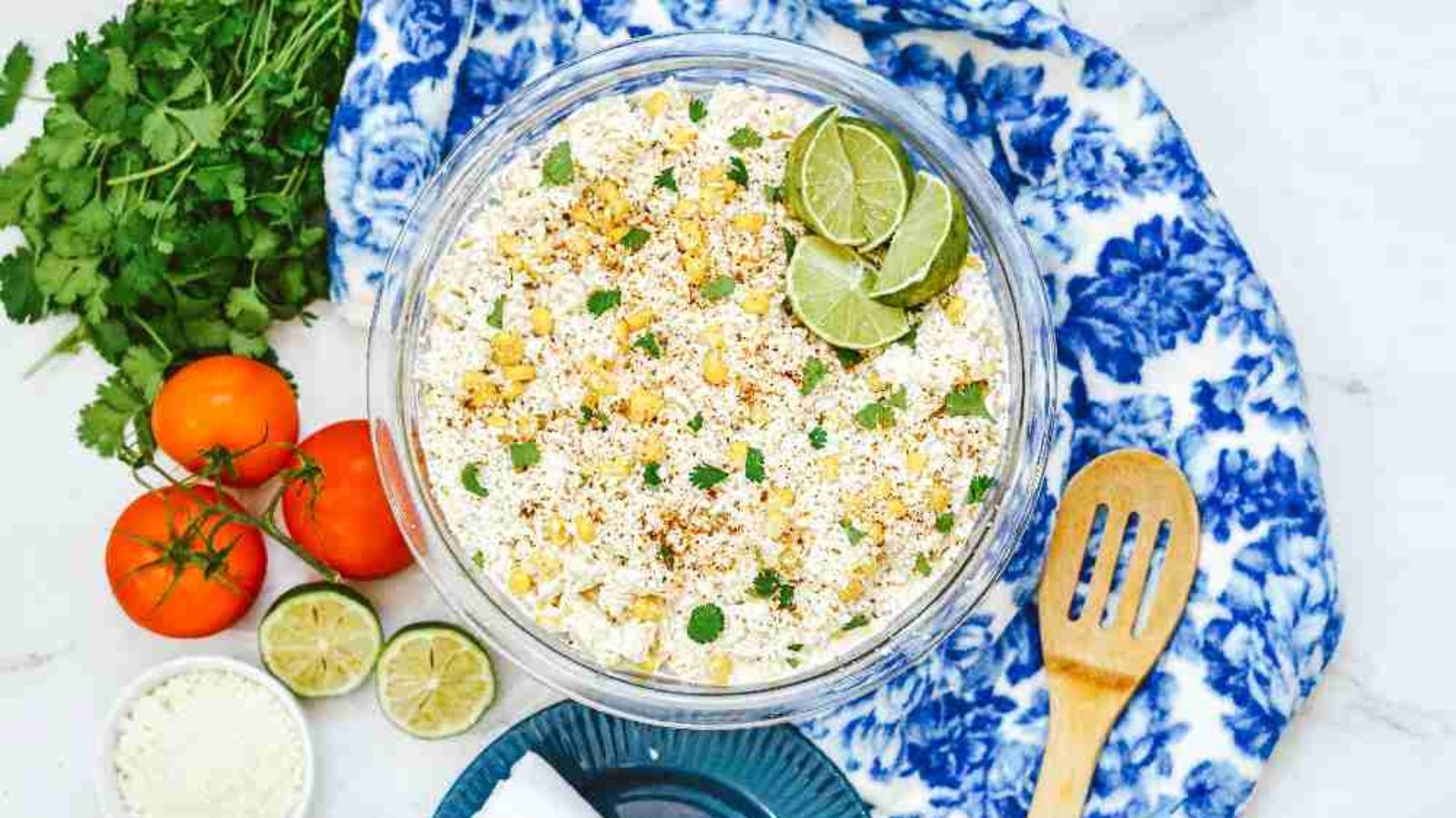 Pasta salad with corn in a bowl.