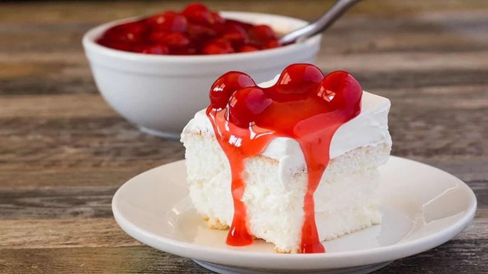 A slice of cake with syrup on top.