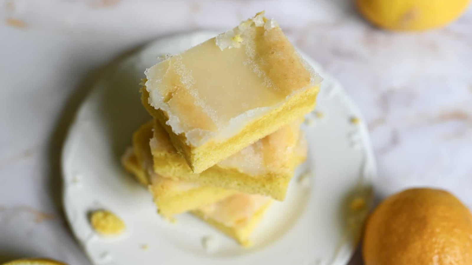 Lemon brownies on a plate.