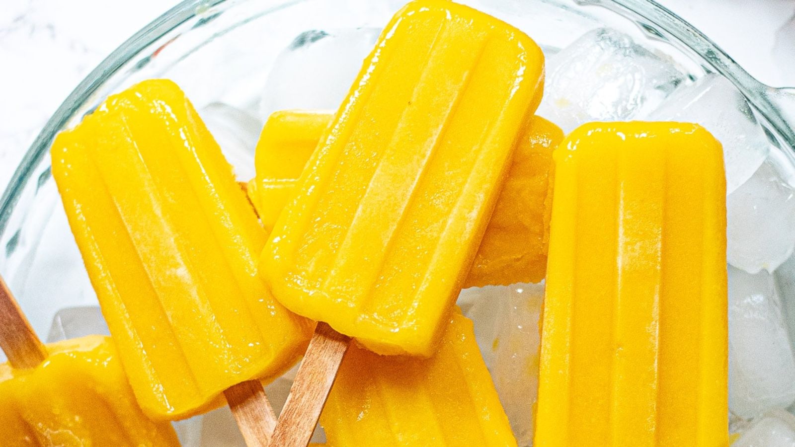 Mango popsicles in a bowl.