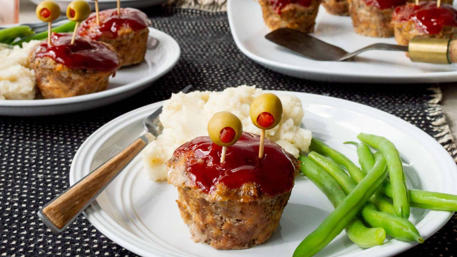 Mini monster meatloaf on a plate.