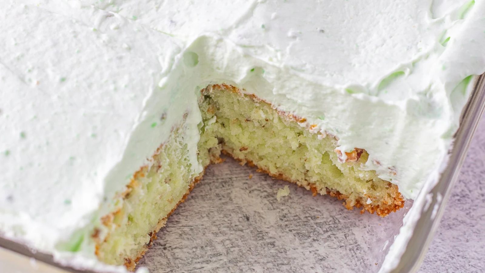 Pistachio cake with slice.