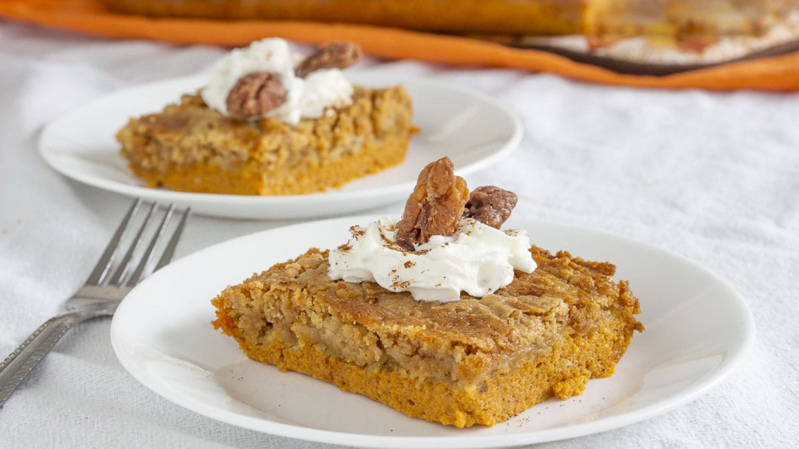 Pumpkin dump cakes on two plates.