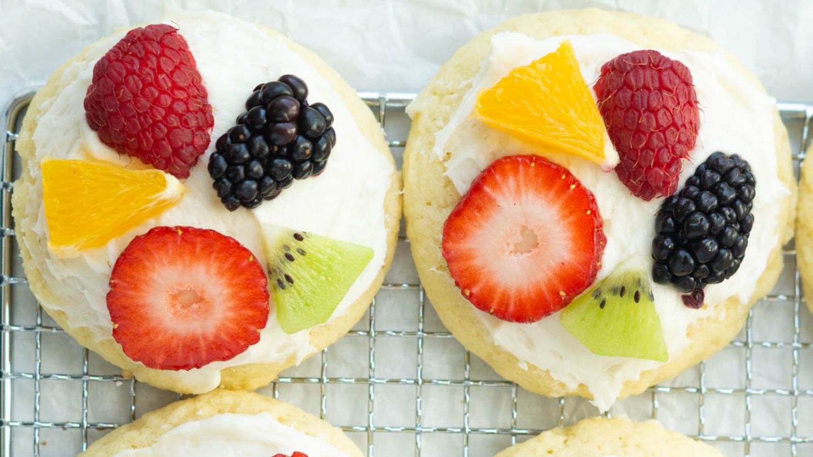 Cookies with fruits on top.