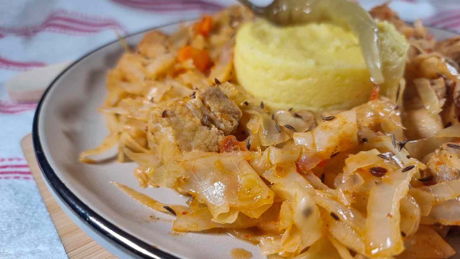 Cabbage and pork on a plate.