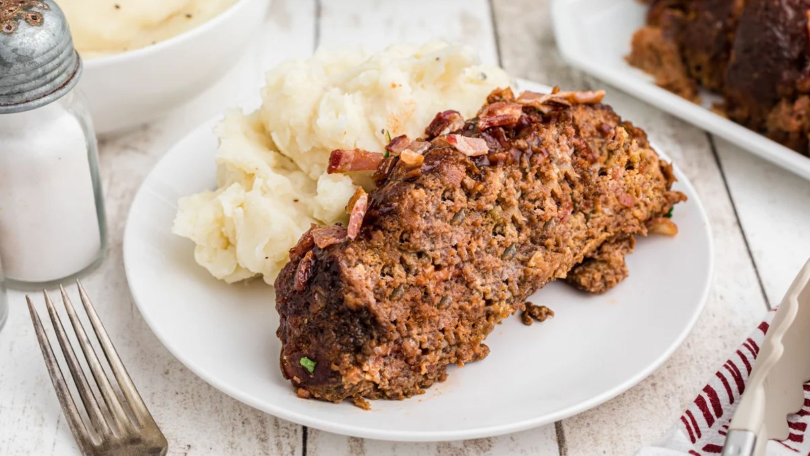Bacon barbecue meatloaf on a plate.