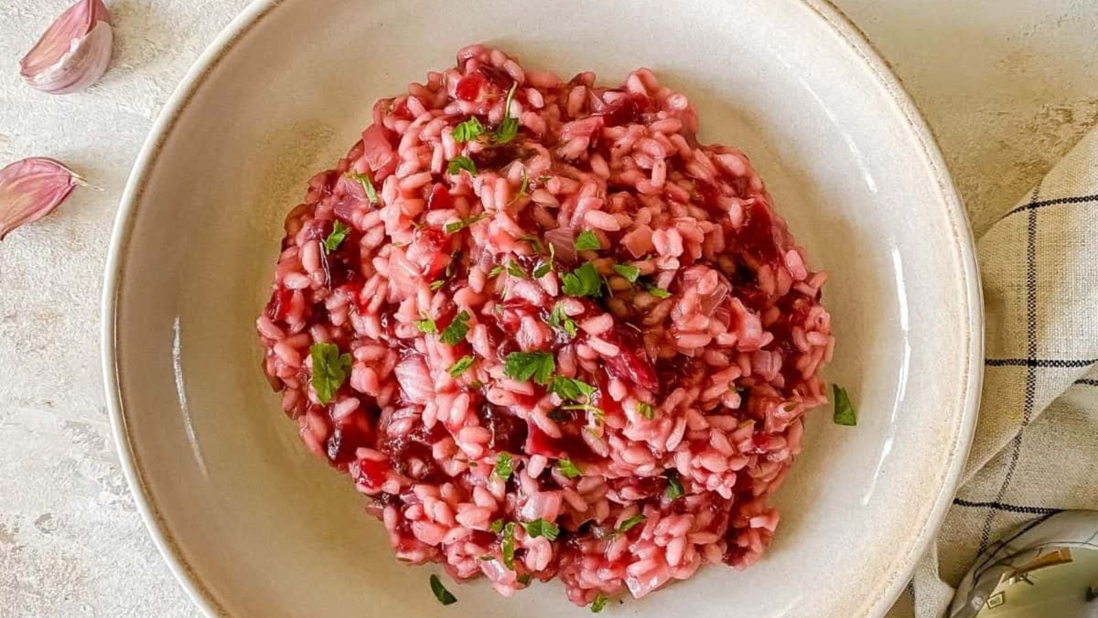 Vegan beetroot risotto on a plate.