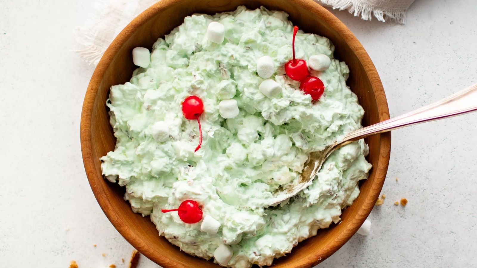 Watergate salad with cherries on top.