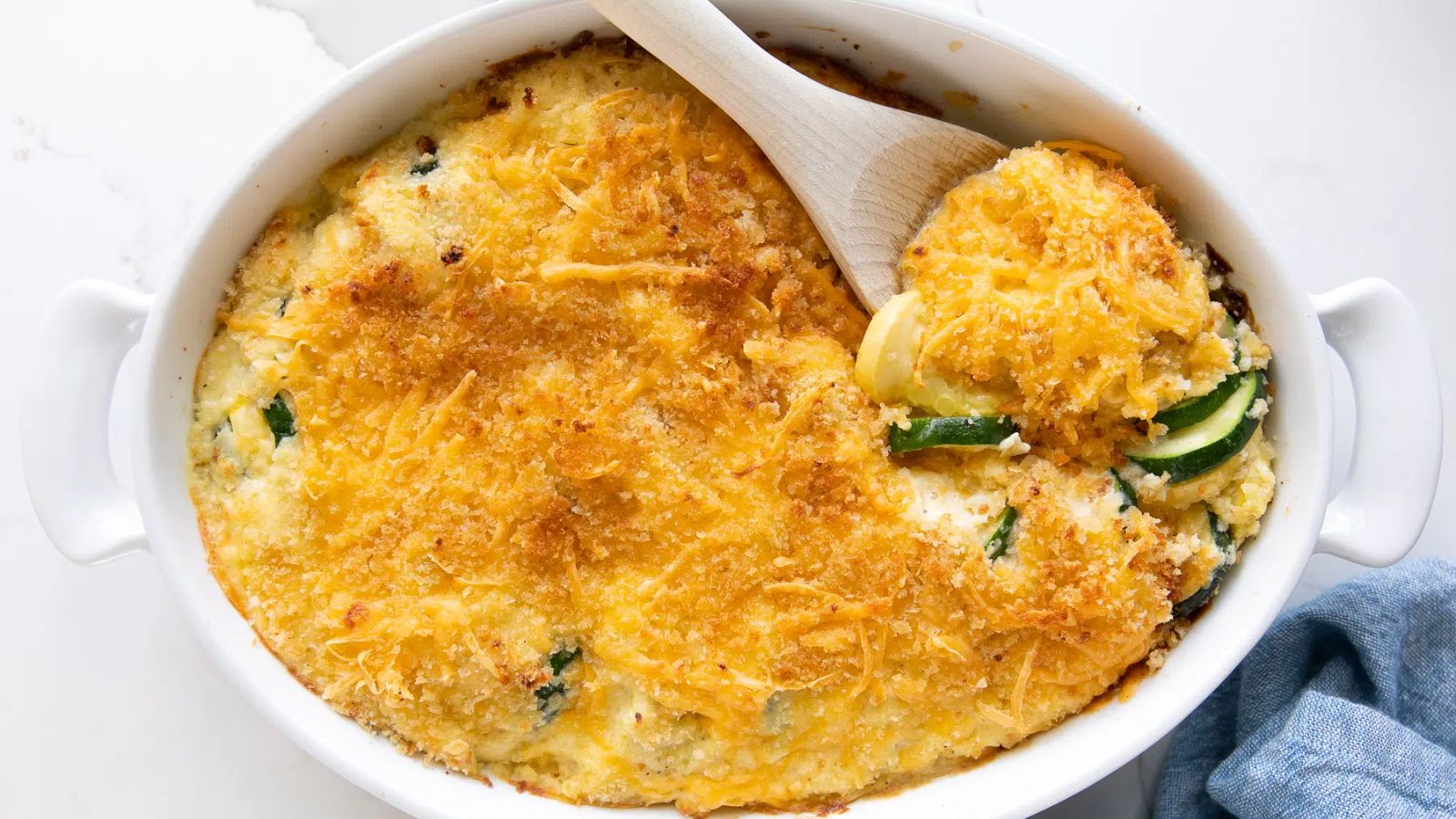 Zucchini casserole on a glass tray.