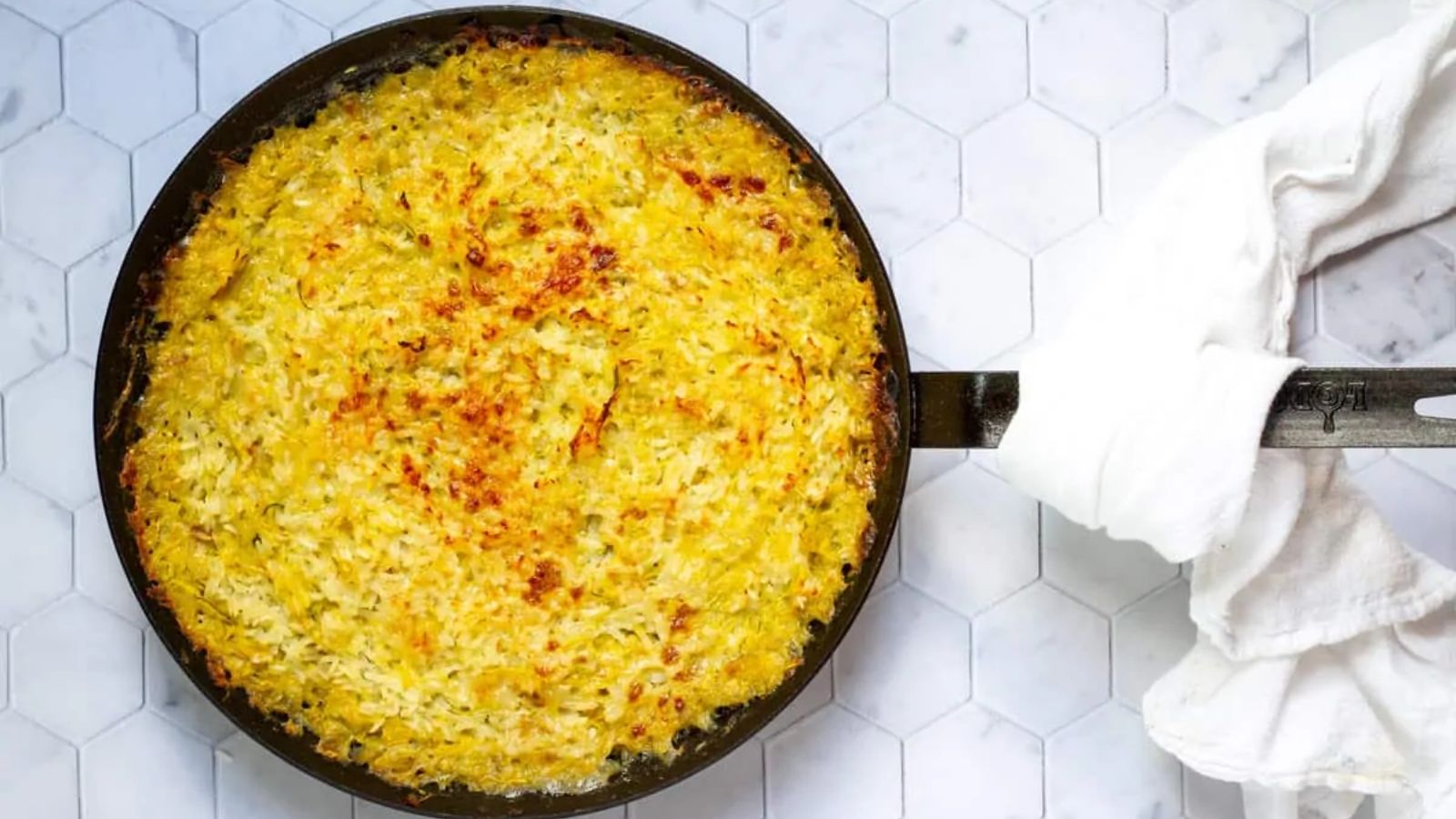 Zucchini rice gratin in a pan.