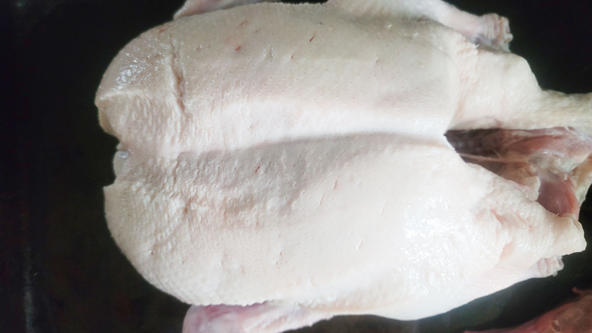 Holes poked into the skin of the duck.