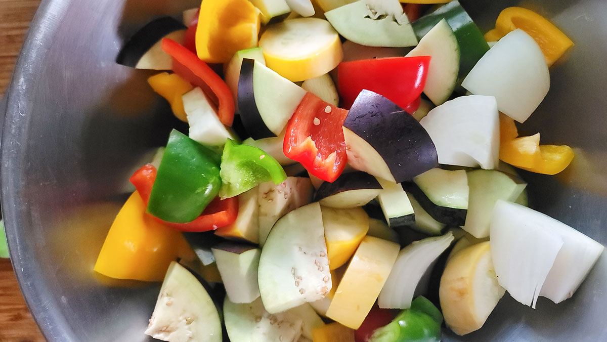 Add all of the cut up vegetables to a large bowl.