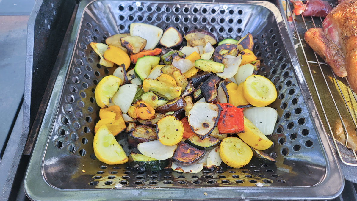 Mixed vegetables in a grill basket.
