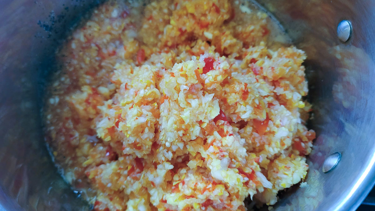Vegetable mixture added to the pot.