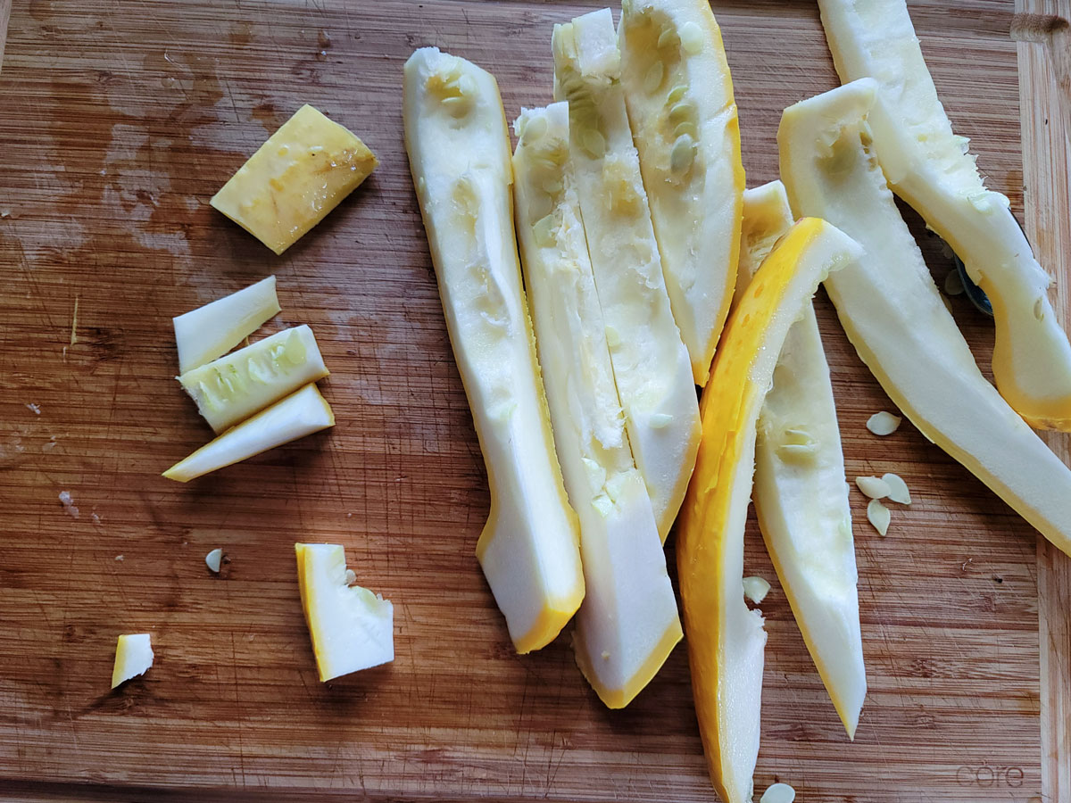 Sliced squash on a cutting board.