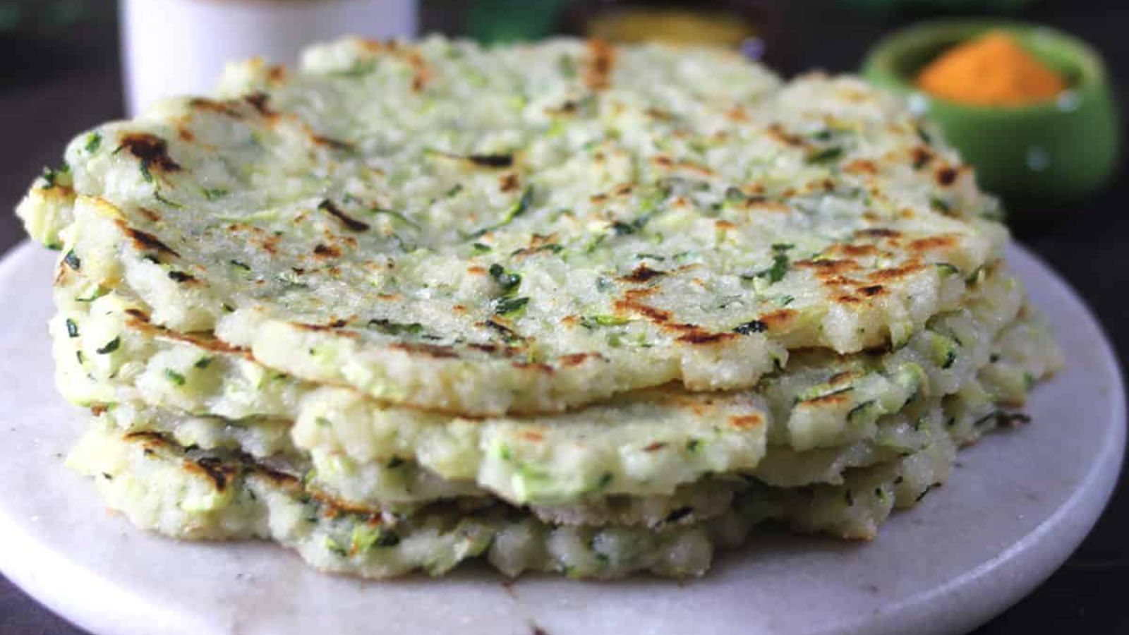 Zucchini pancakes on a plate.