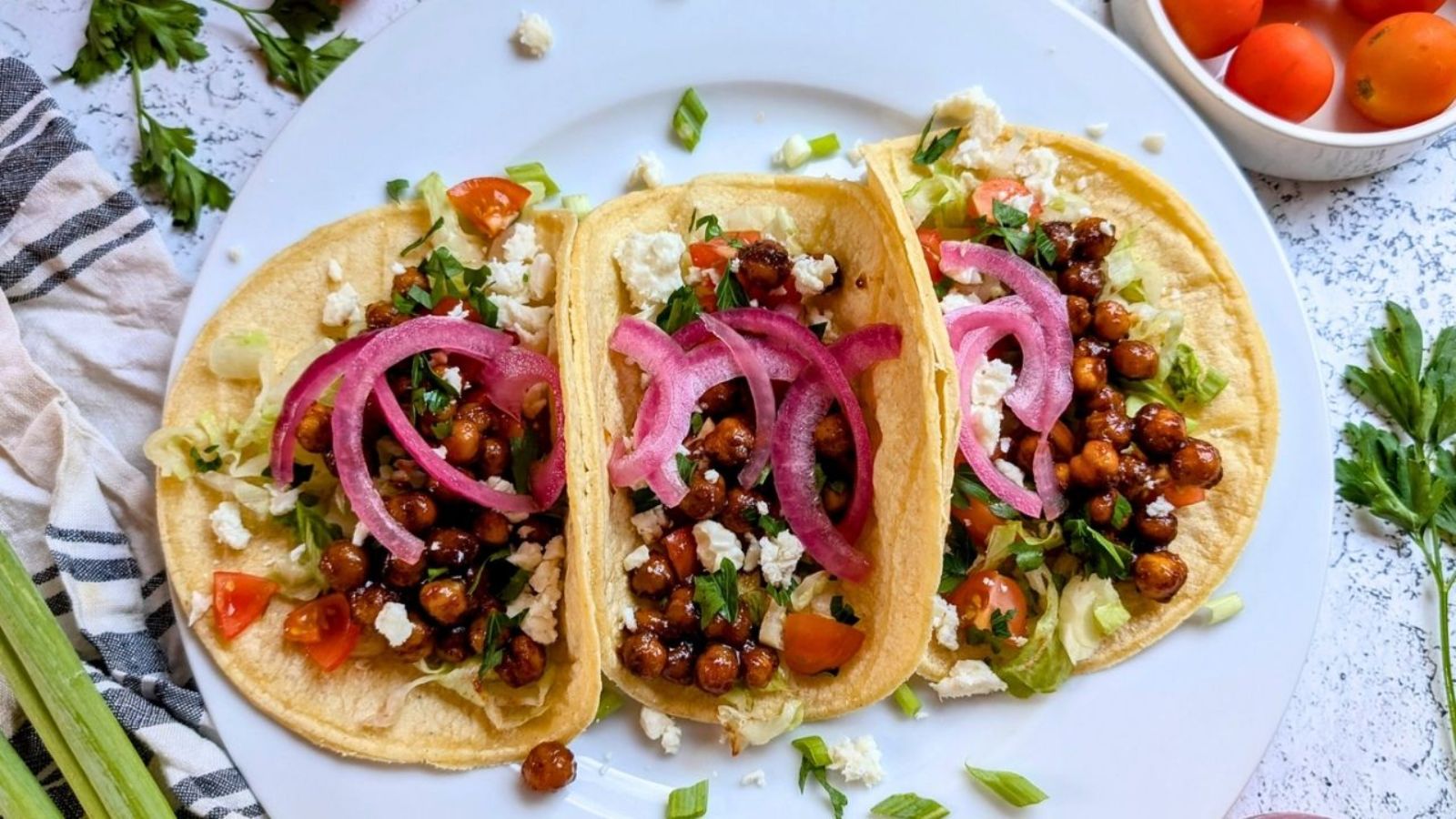 Three chickpea tacos on a plate.
