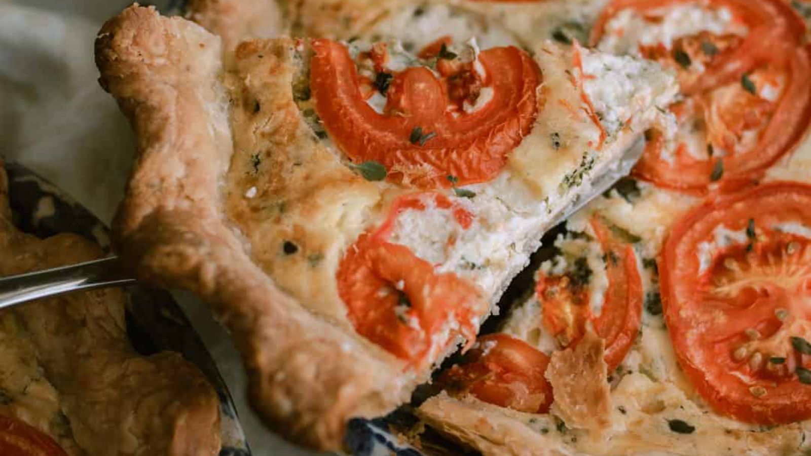 A slice of broccoli goat cheese quiche.