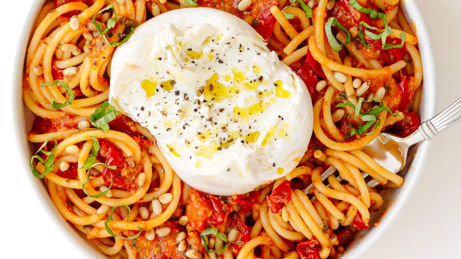 Pasta with burrata on top.
