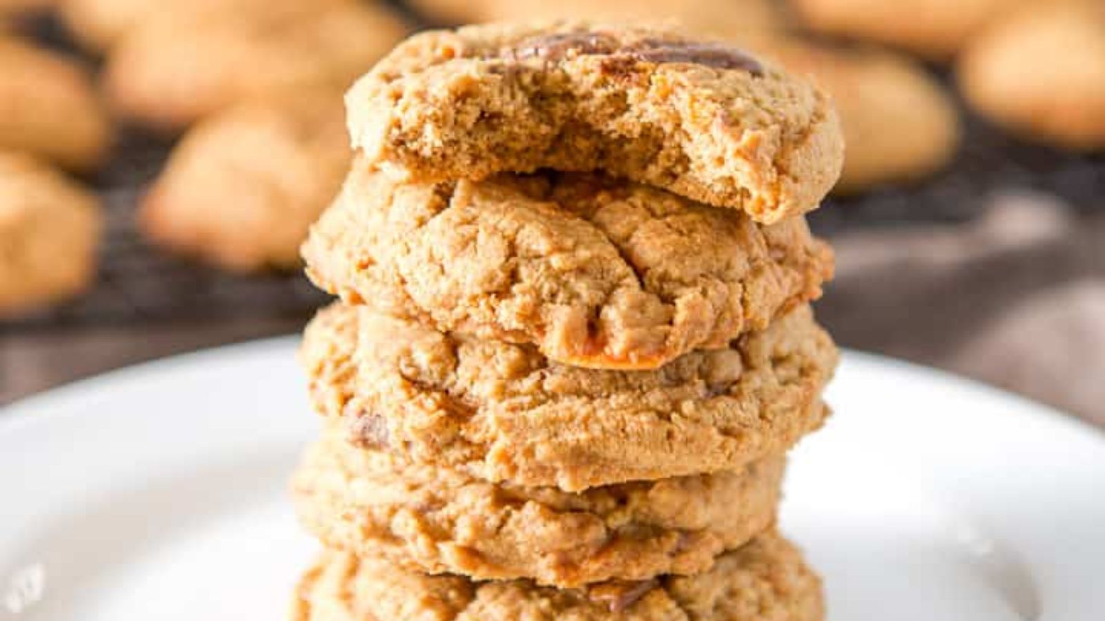 Stack of butterfinger cookies on a plate.