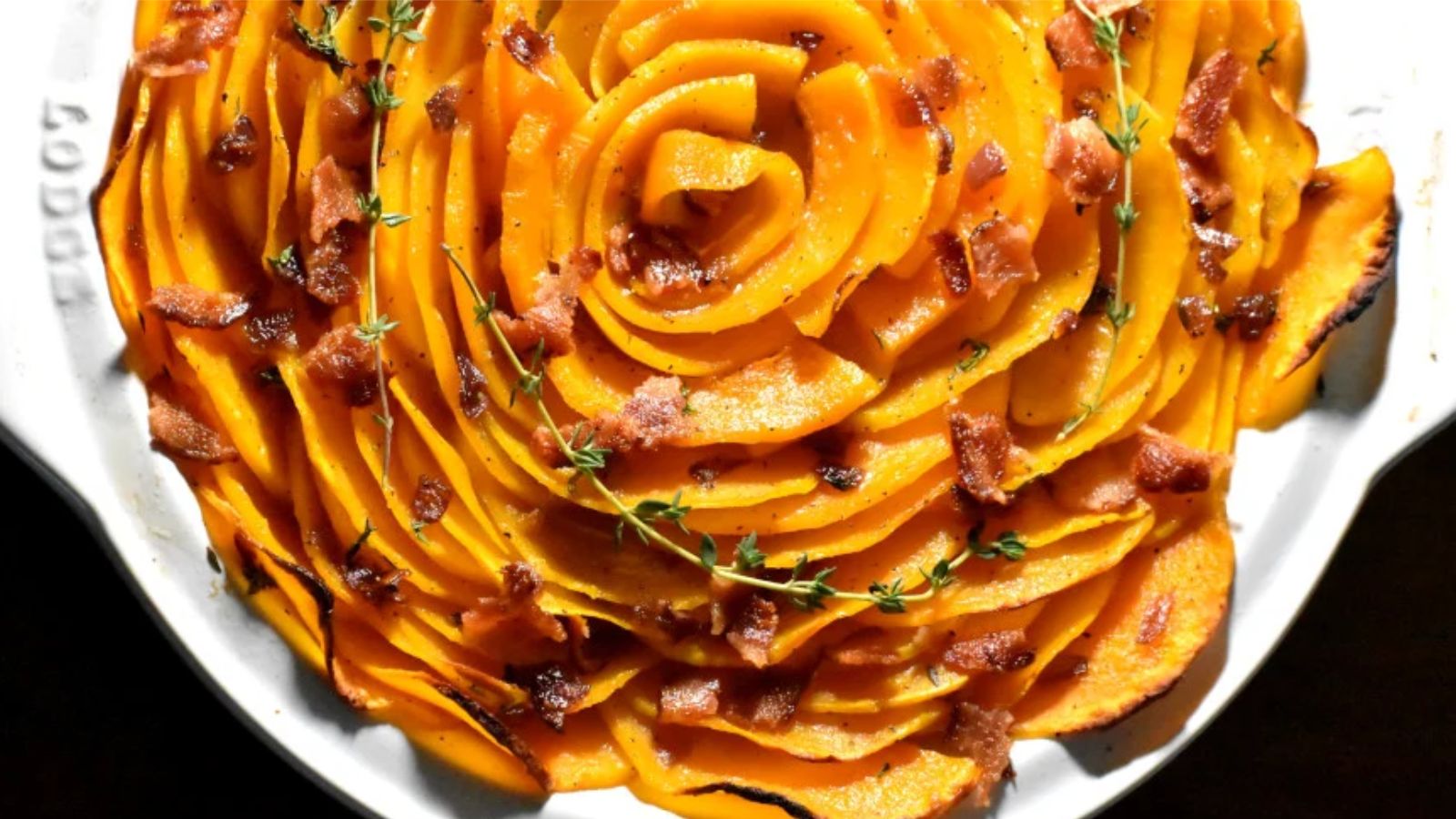 Butternut squash on a white plate.