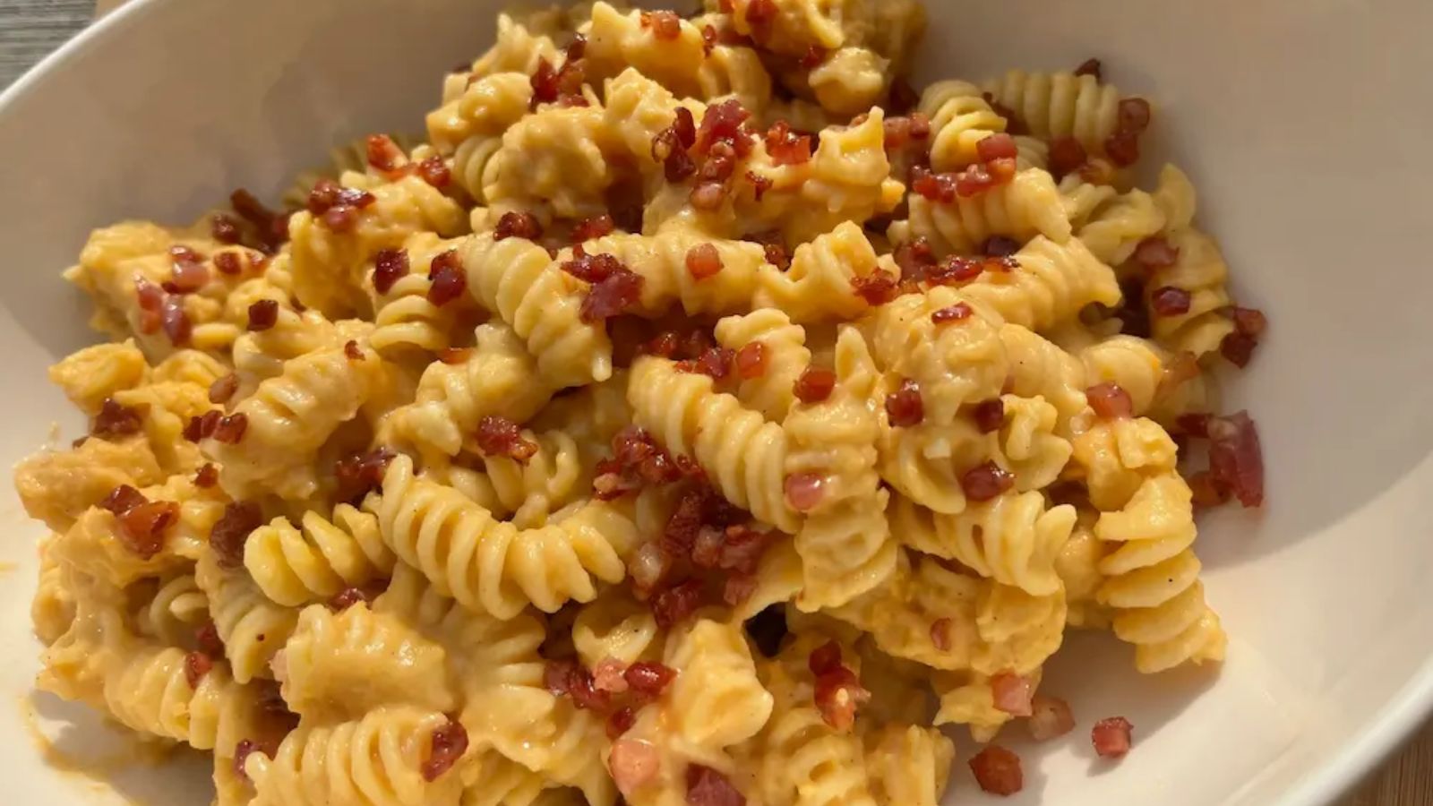 Squash cottage cheese pasta with bacon bits.