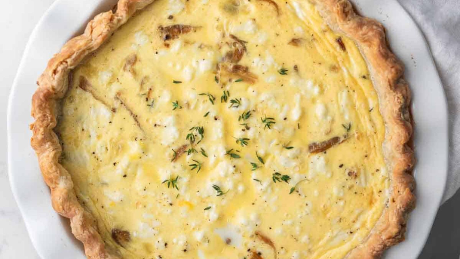 Whole onion quiche close up.
