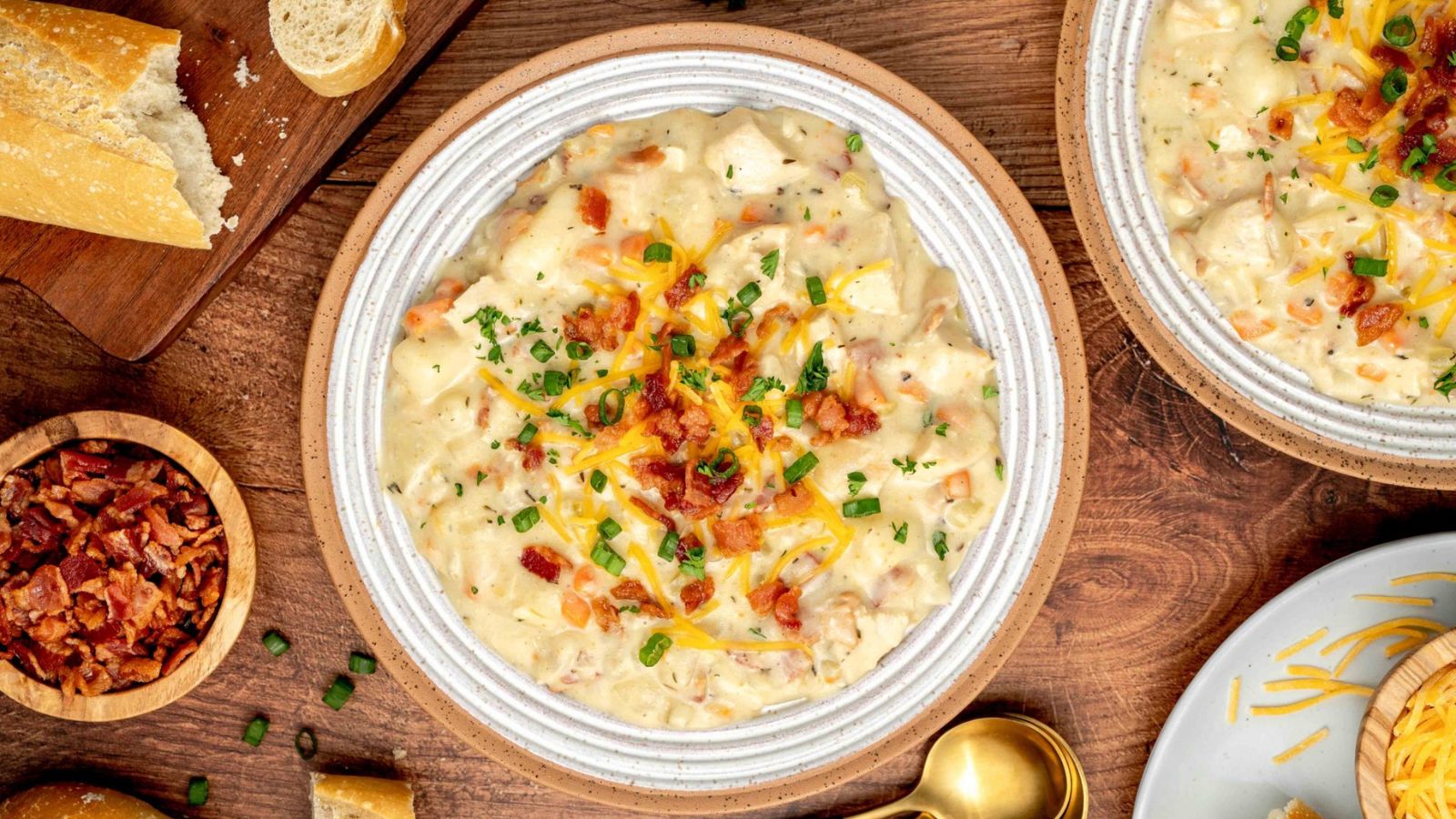 Chicken and potato soup with toppings.