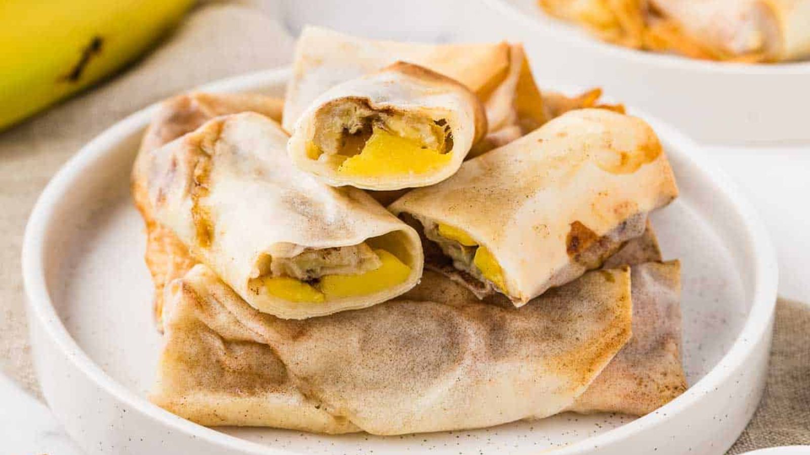 Banana spring rolls on a plate.