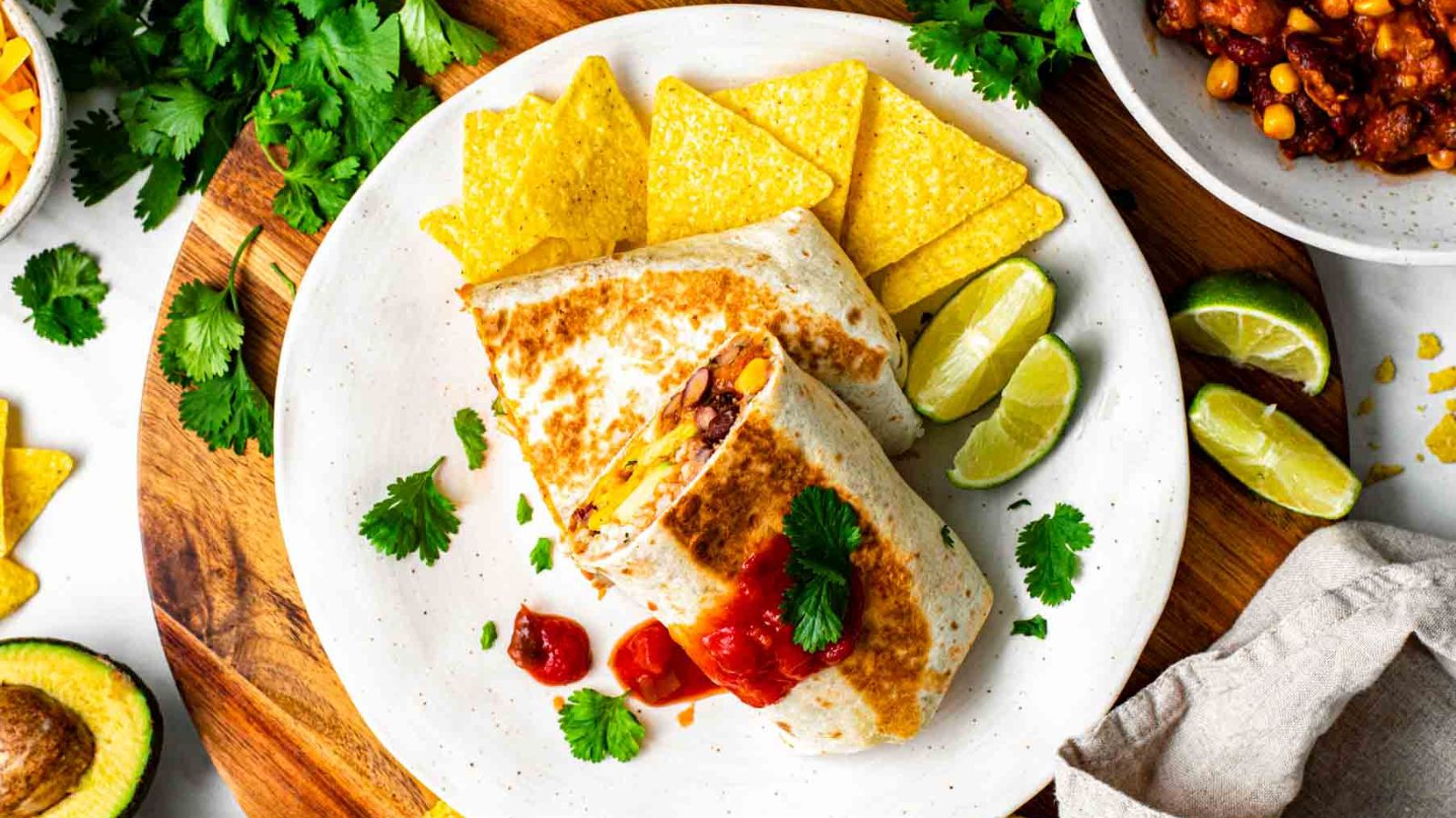 Chili burrito with chips on the side.