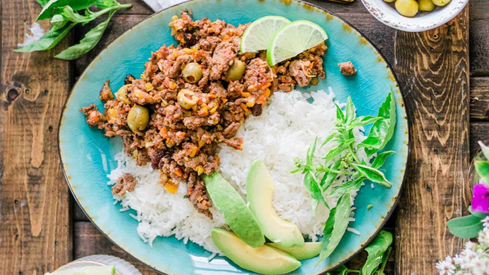 Picadillo with sliced avocados.