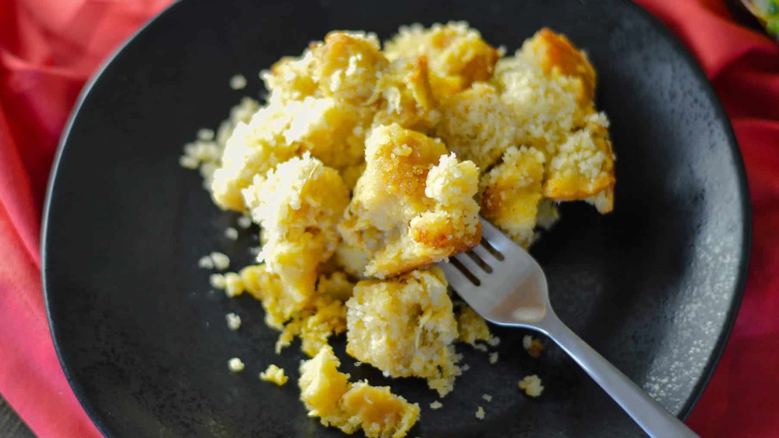 Scalloped pineapple casserole on a plate.