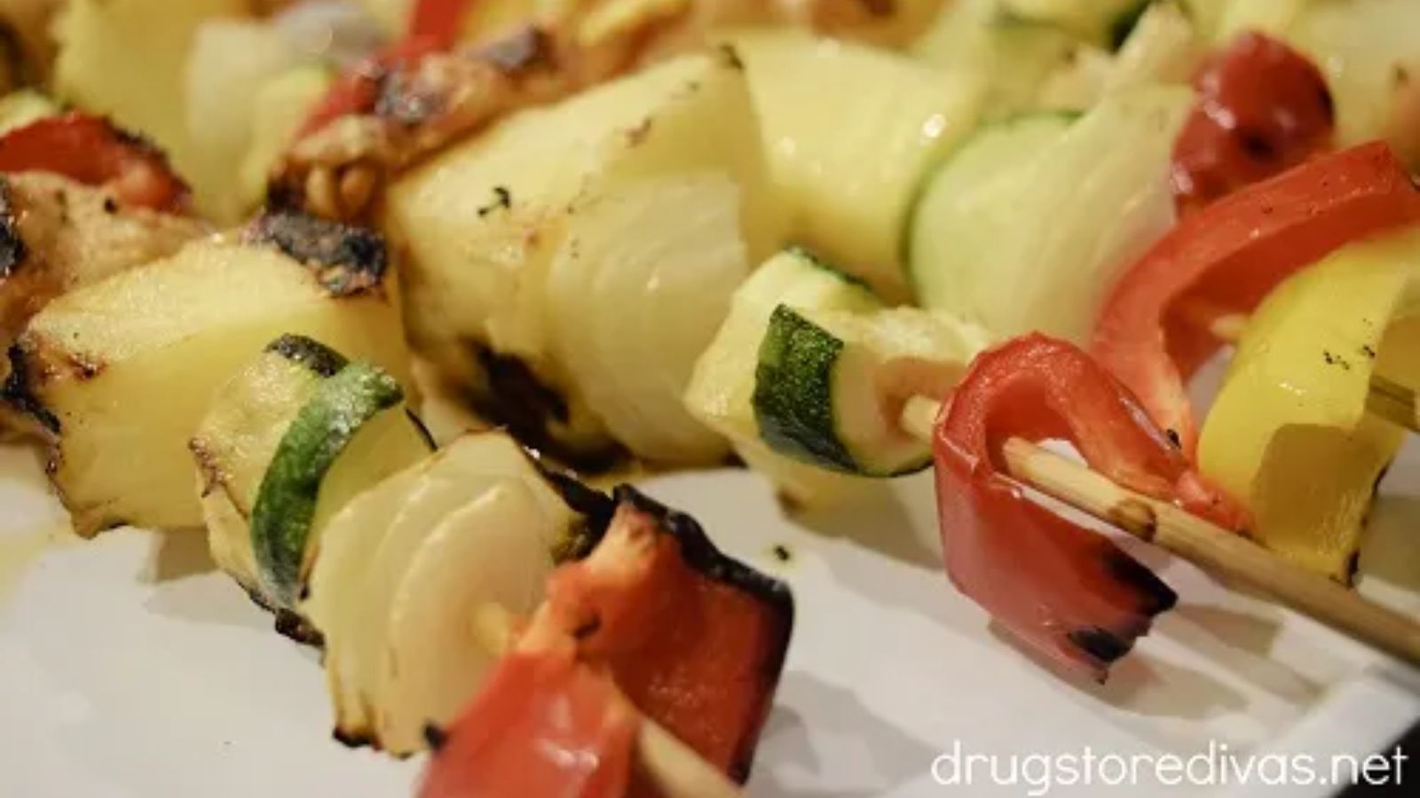 Hawaiian chicken kabobs on sticks.