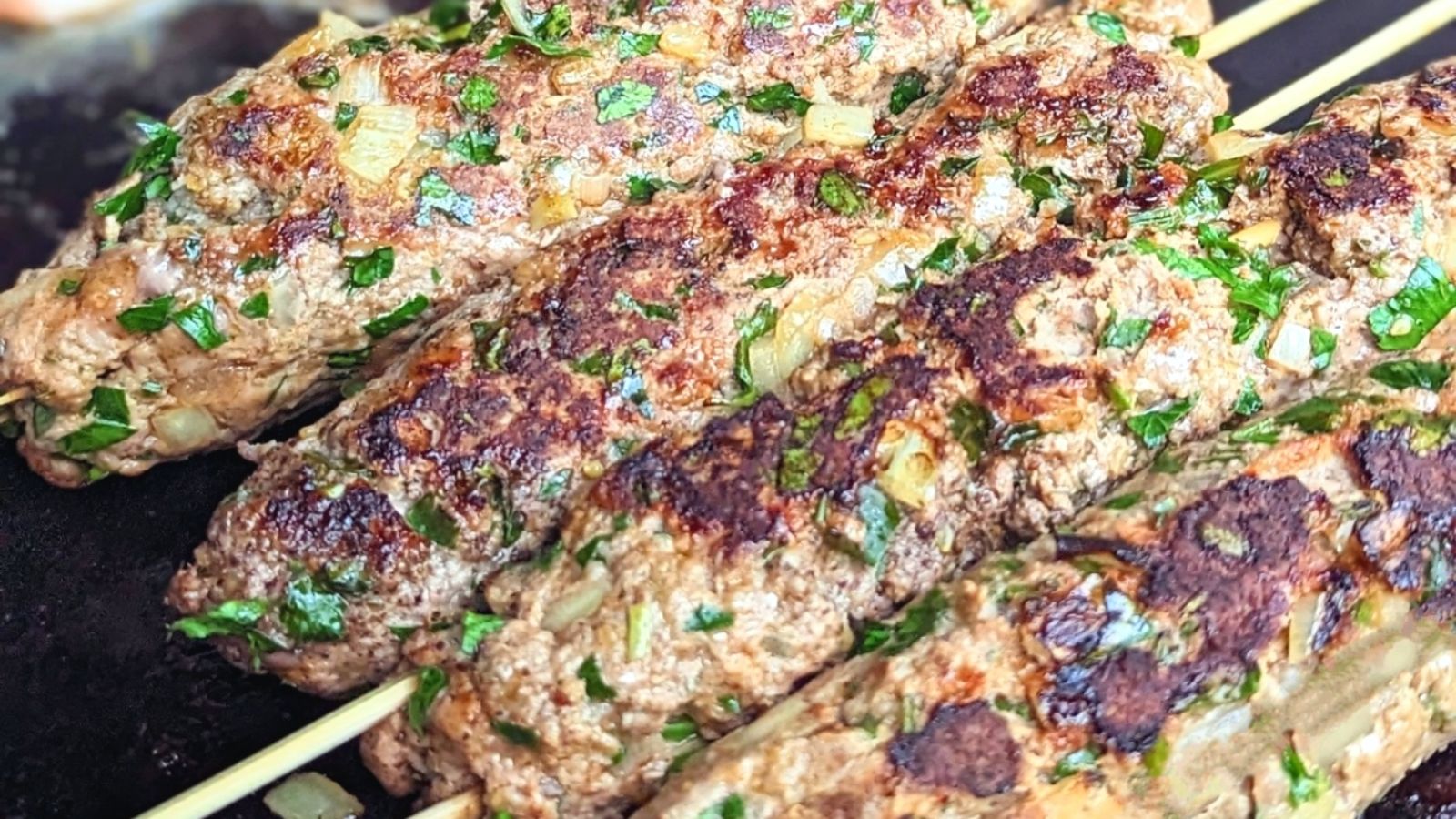 Ground beef kebab on sticks.