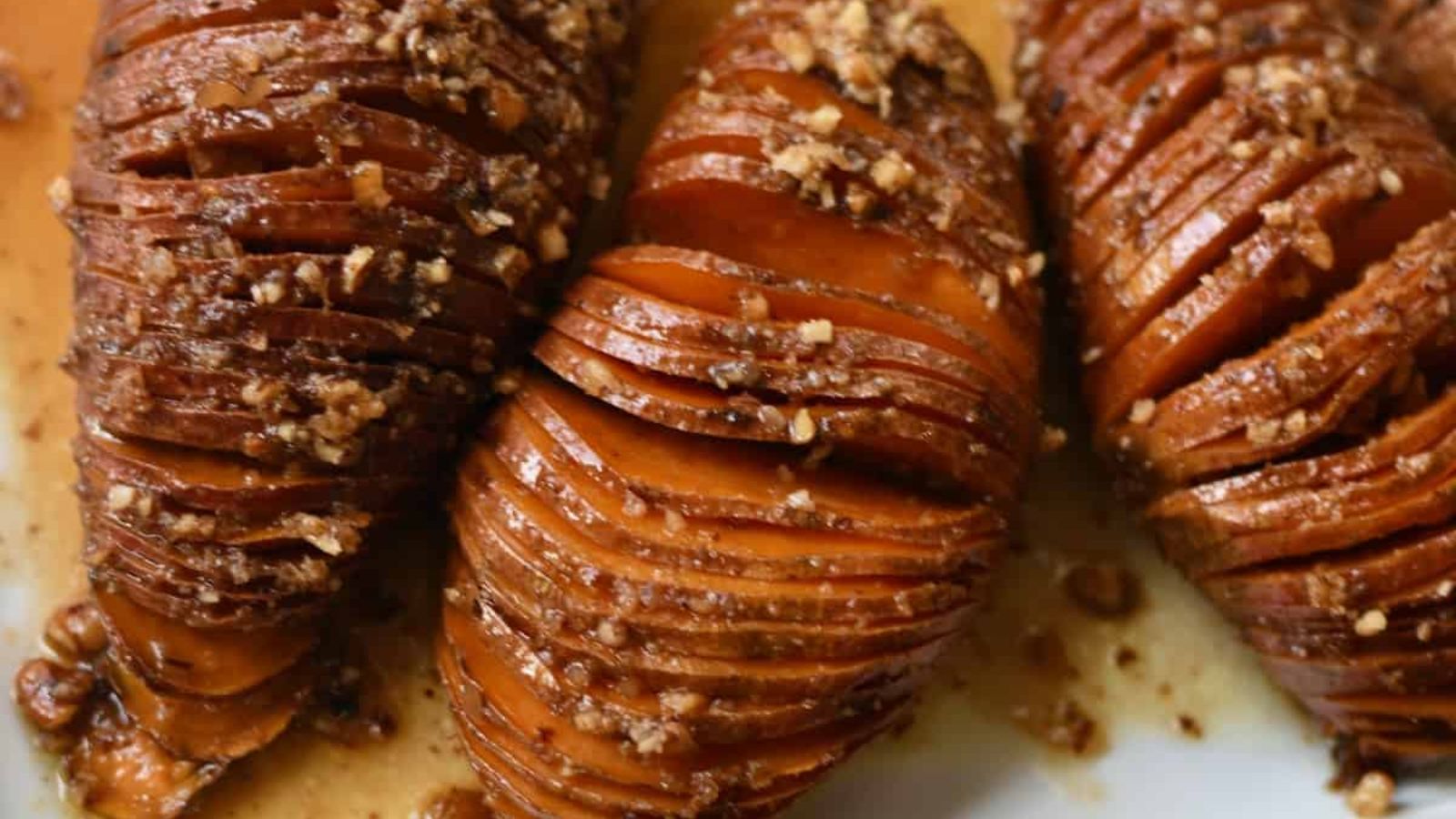 Hasselback sweet potatoes with maple and pecans.