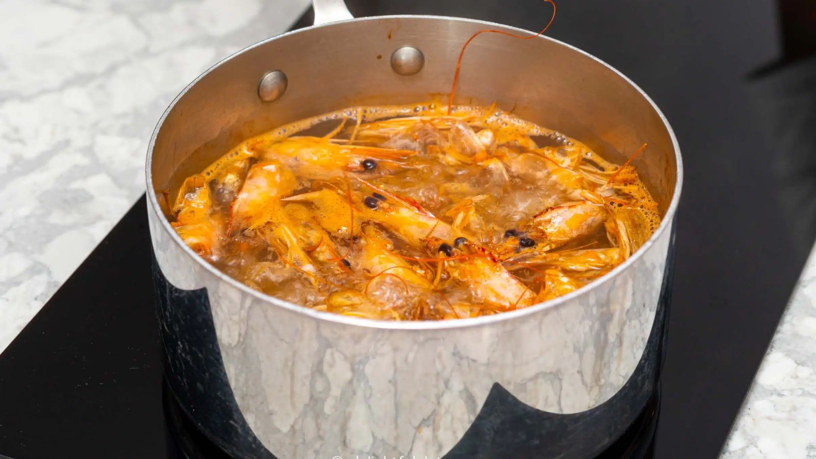 Shrimp stock in a pot.