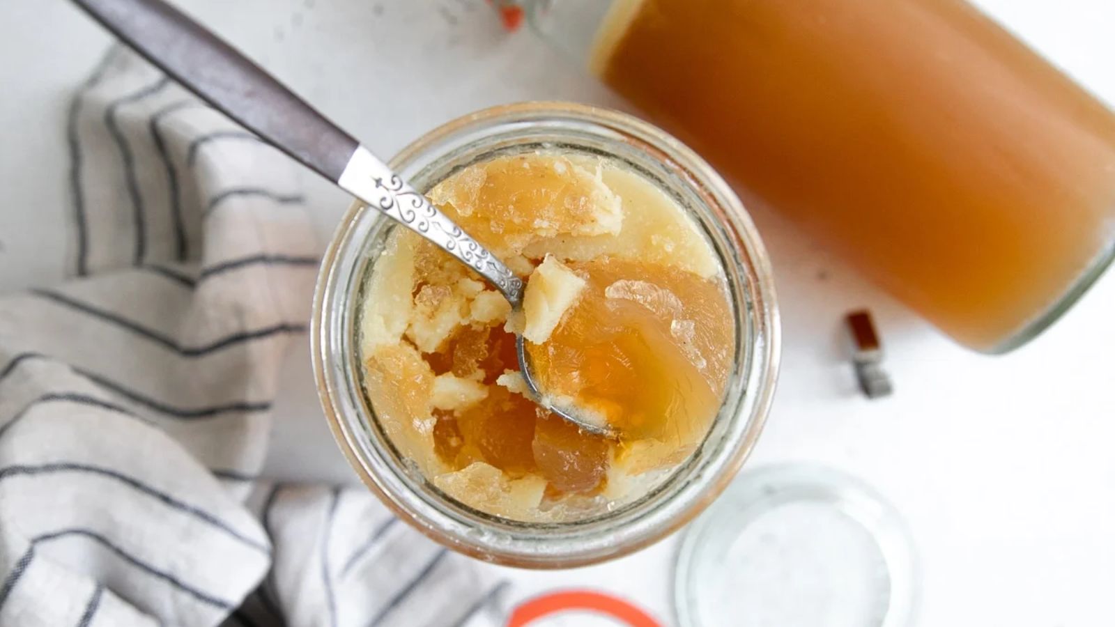 Bone broth in a glass jar.