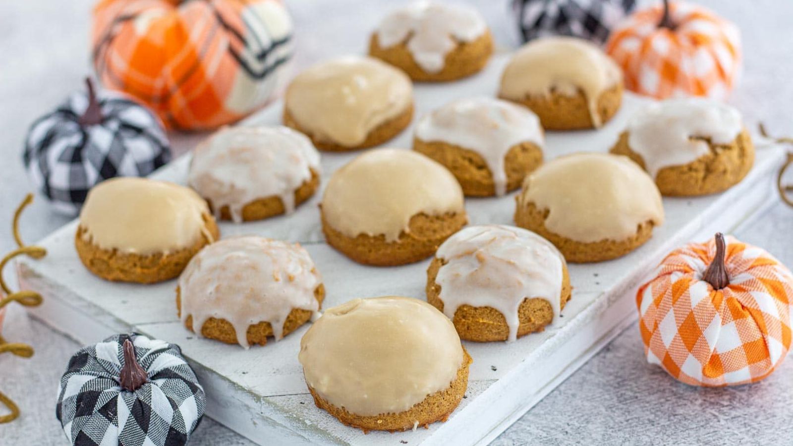 Iced pumpkin cookies with cream.