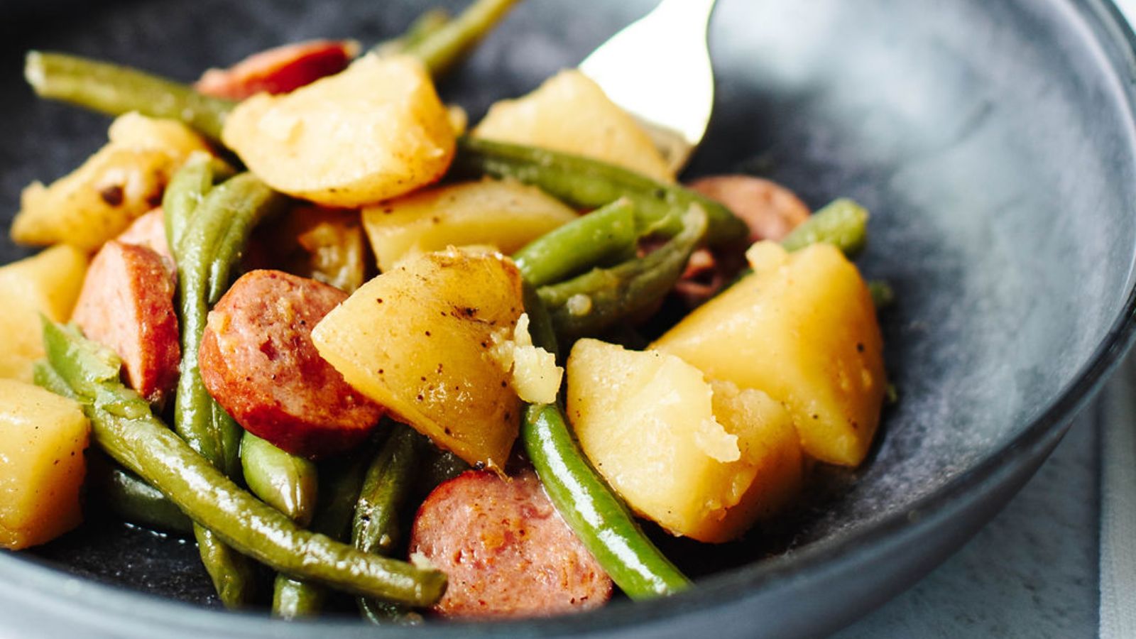Cajun sausage with green beans and potatoes.