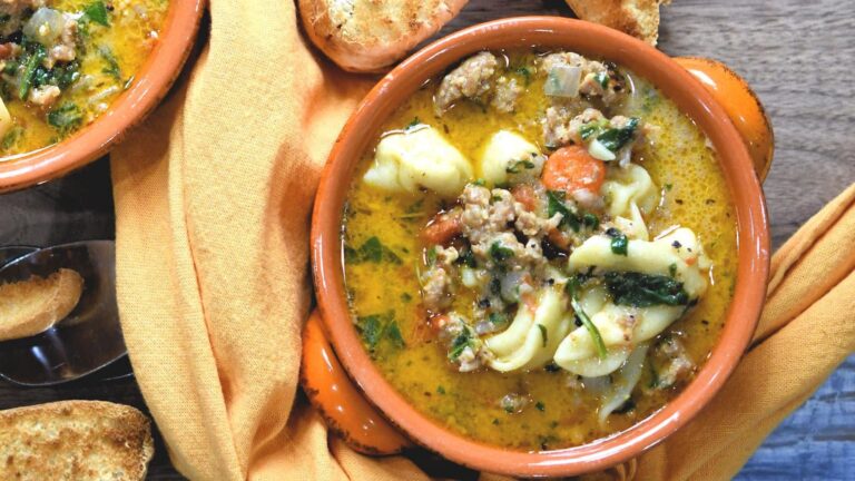 Tortellini soup in a bowl.